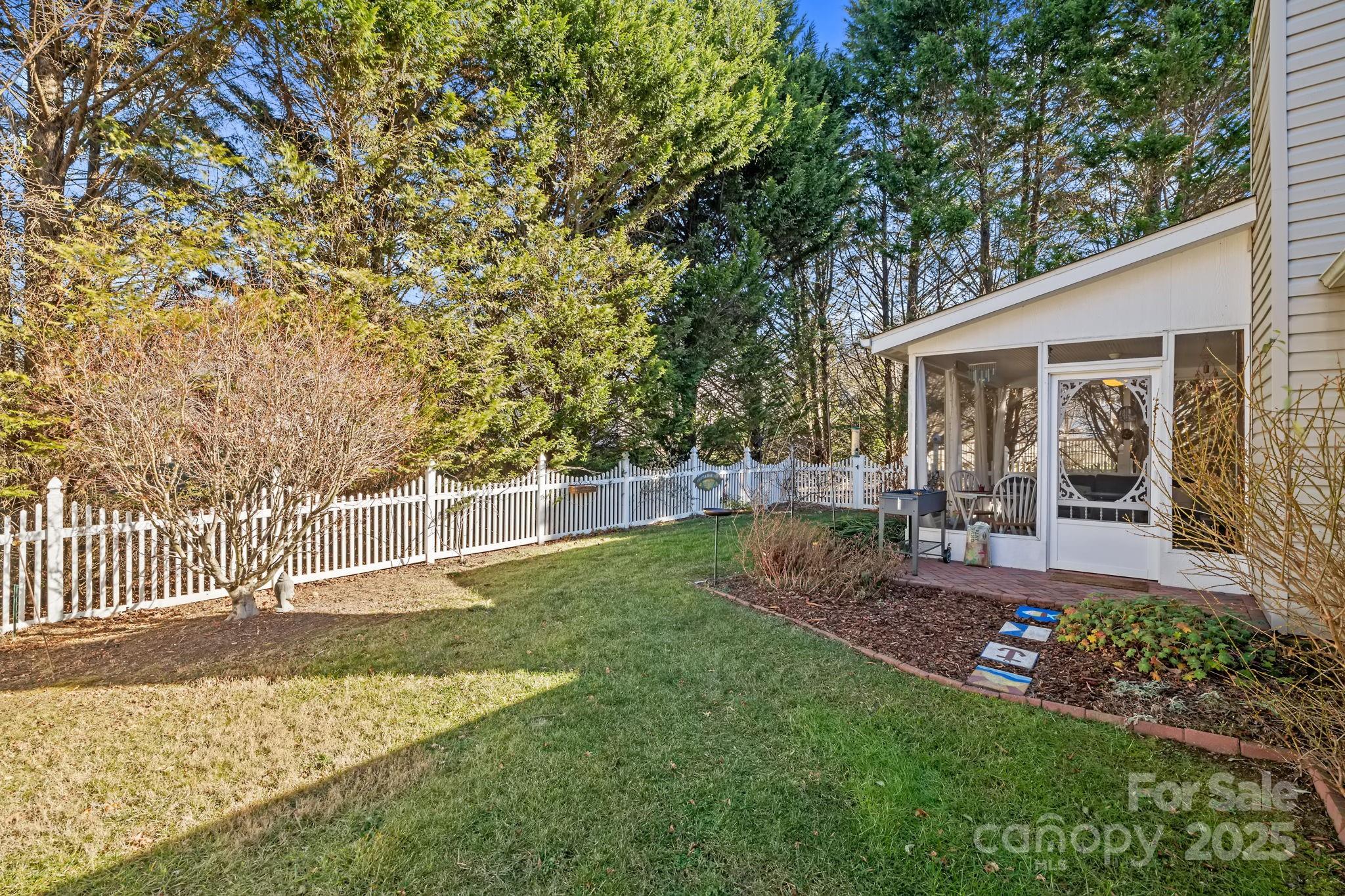 28 Sand Pebble Court Fletcher, NC 28732 - Photo 32 of 35 a view of a backyard with sitting area