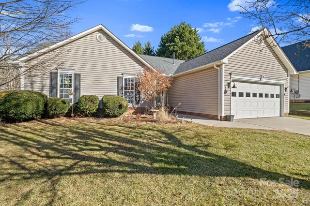 a view of large house with a yard
