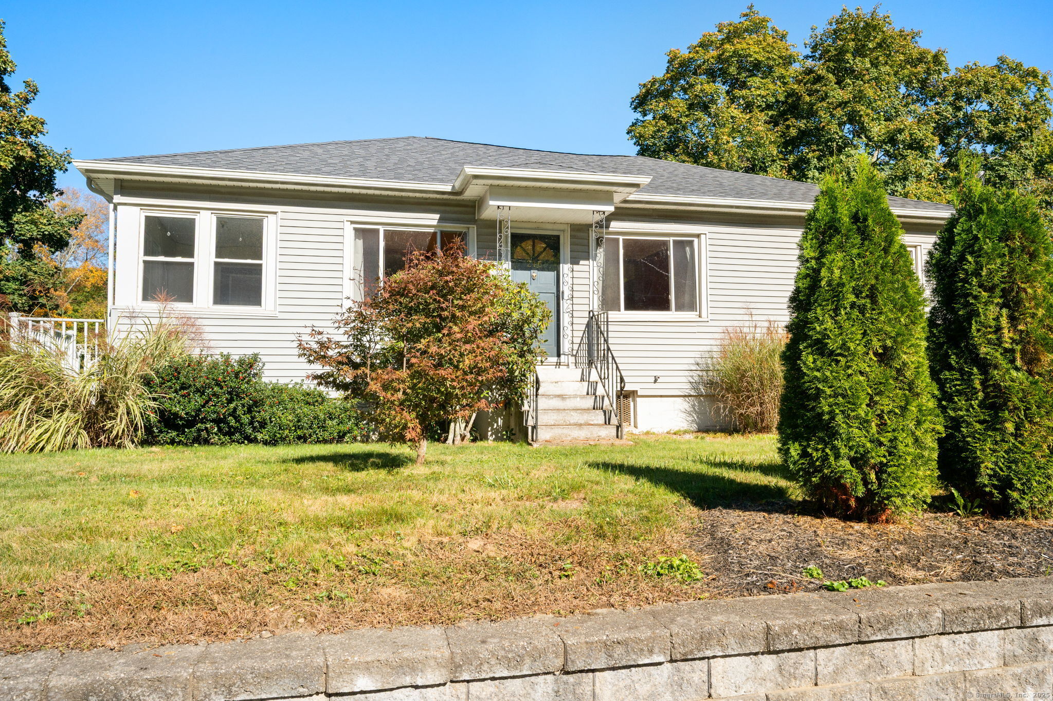 216 Main Street Sprague, CT 06330 - Photo 1 of 1 a front view of a house with garden