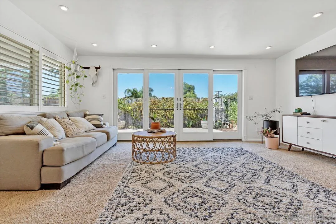 1347 Rex Lane El Cajon, CA 92021 - Photo 17 of 57 a living room with furniture and large windows
