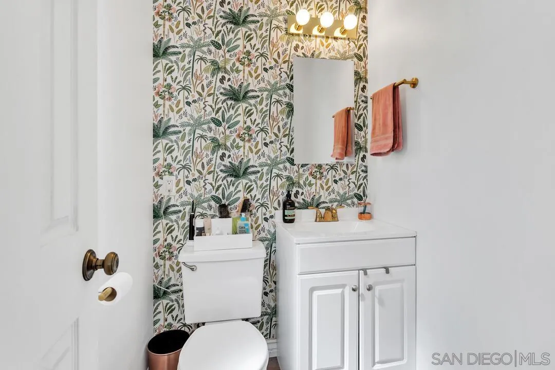 1347 Rex Lane El Cajon, CA 92021 - Photo 25 of 57 a bathroom with a sink toilet and mirror