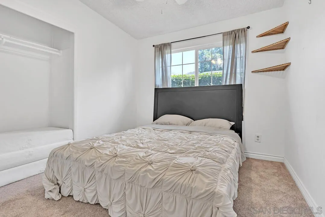 1347 Rex Lane El Cajon, CA 92021 - Photo 28 of 57 a large white bed in a small room