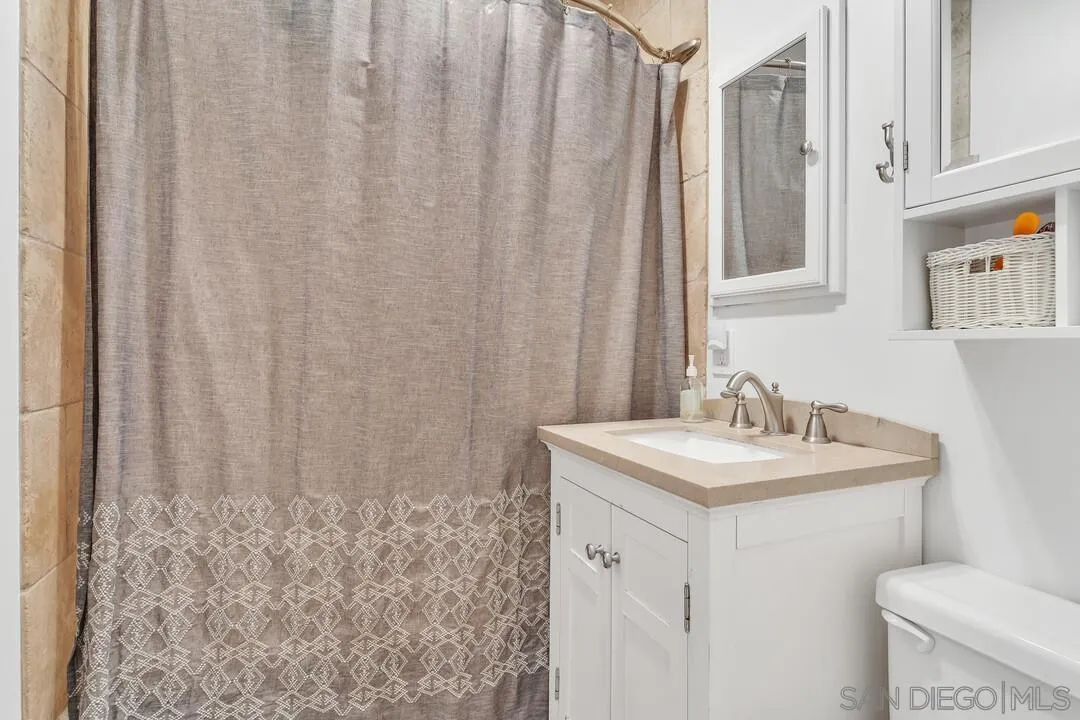 1347 Rex Lane El Cajon, CA 92021 - Photo 30 of 57 a bathroom with a sink and a toilet