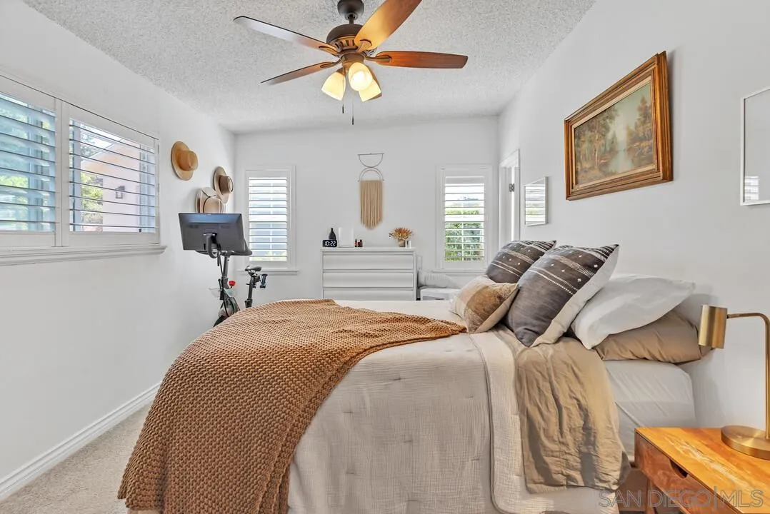 1347 Rex Lane El Cajon, CA 92021 - Photo 31 of 57 a bedroom with a bed and wooden floor