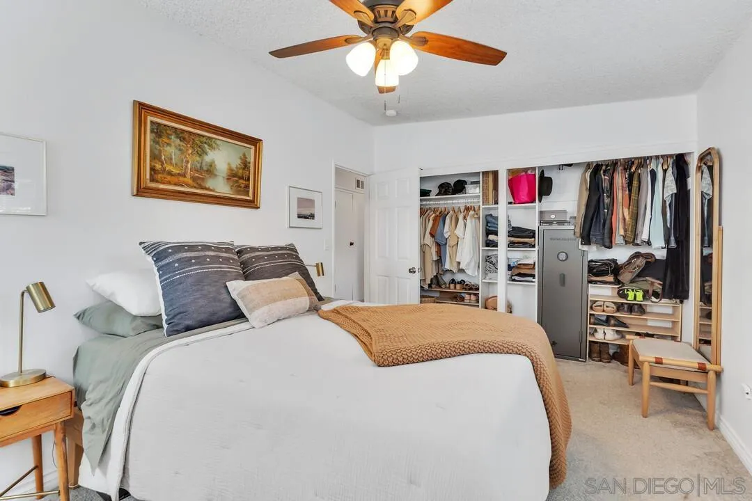 1347 Rex Lane El Cajon, CA 92021 - Photo 33 of 57 a bedroom with bed and a chandelier