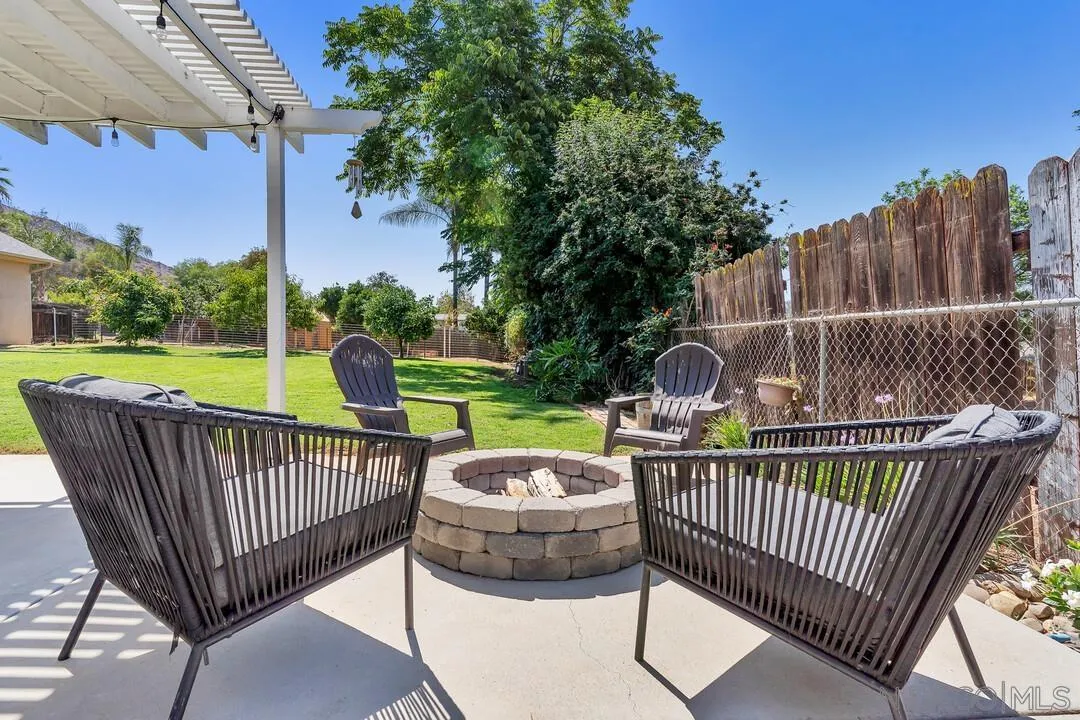 1347 Rex Lane El Cajon, CA 92021 - Photo 35 of 57 a view of a roof deck with two chairs and a yard