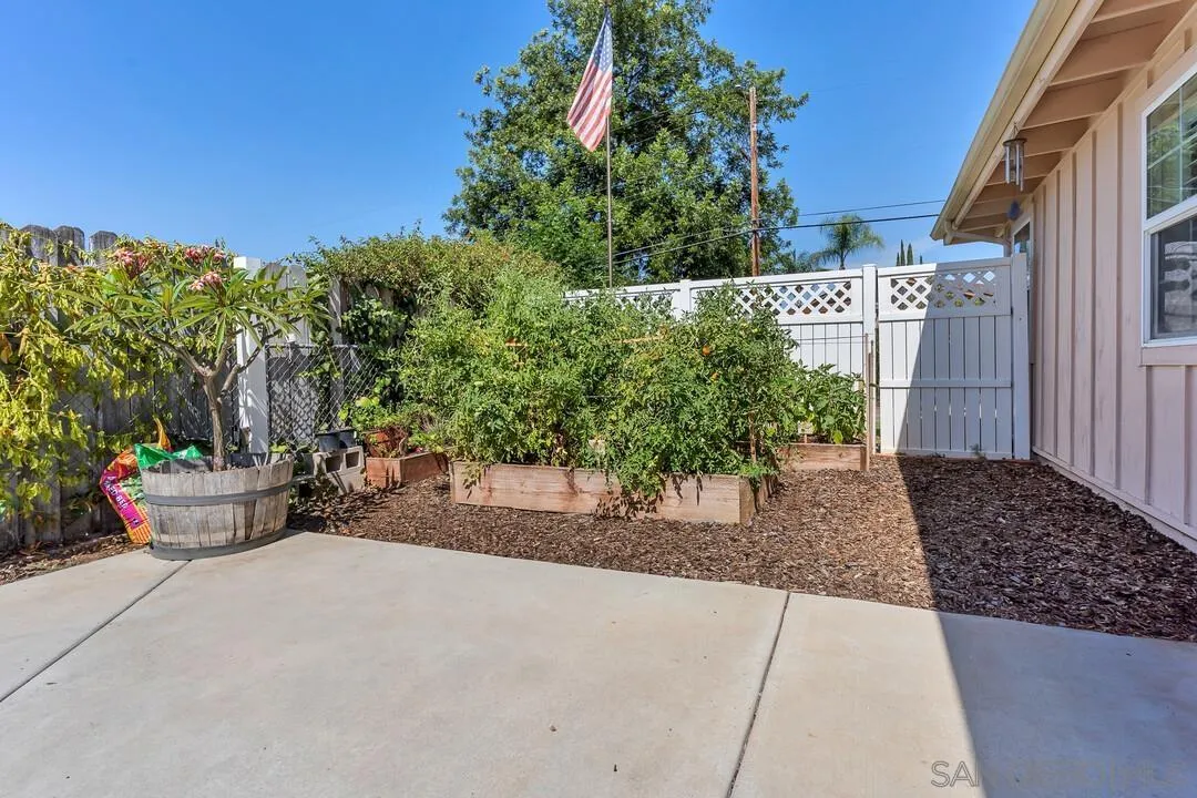 1347 Rex Lane El Cajon, CA 92021 - Photo 36 of 57 a view of a street with potted plants