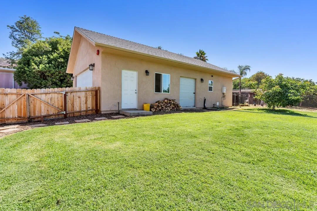 1347 Rex Lane El Cajon, CA 92021 - Photo 39 of 57 a front view of house with yard and trees in the background