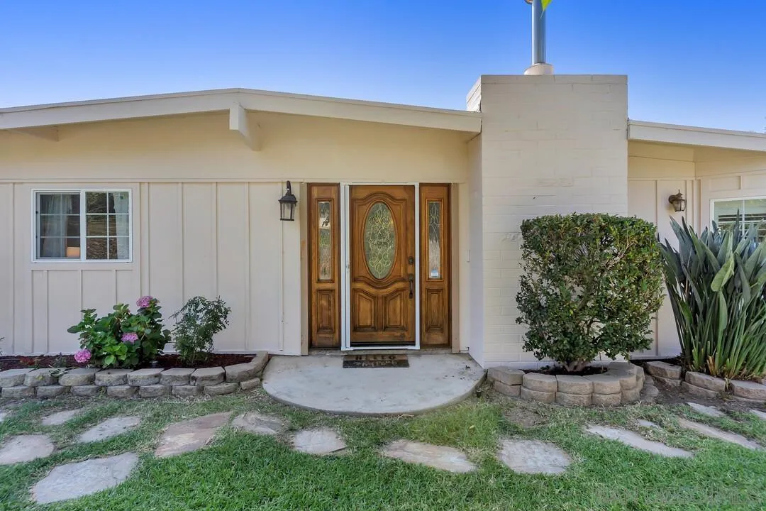 1347 Rex Lane El Cajon, CA 92021 - Photo 4 of 57 a front view of a house with garden