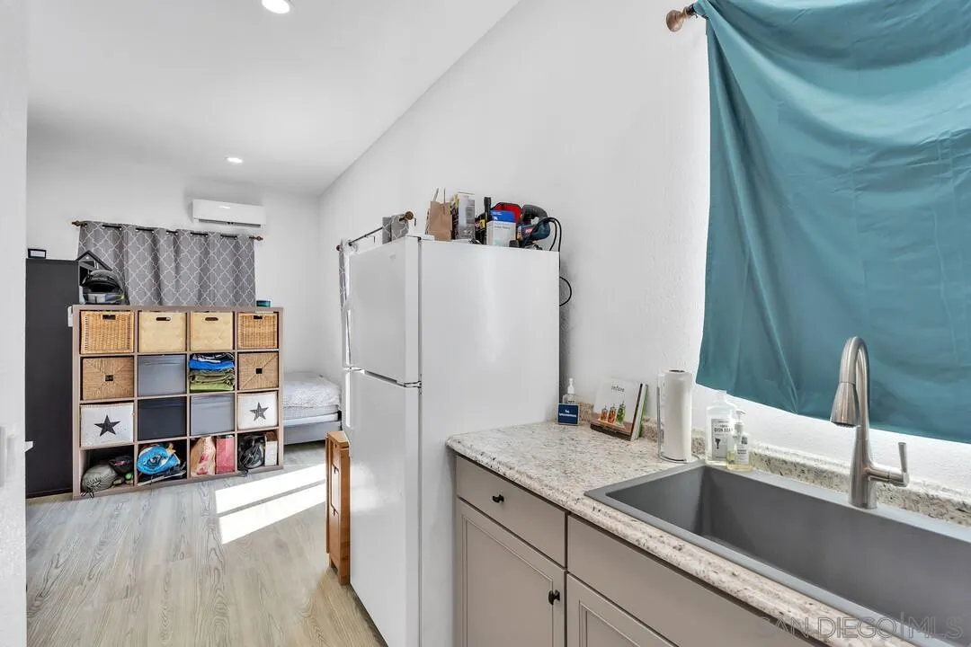 1347 Rex Lane El Cajon, CA 92021 - Photo 42 of 57 a kitchen with a refrigerator and a sink