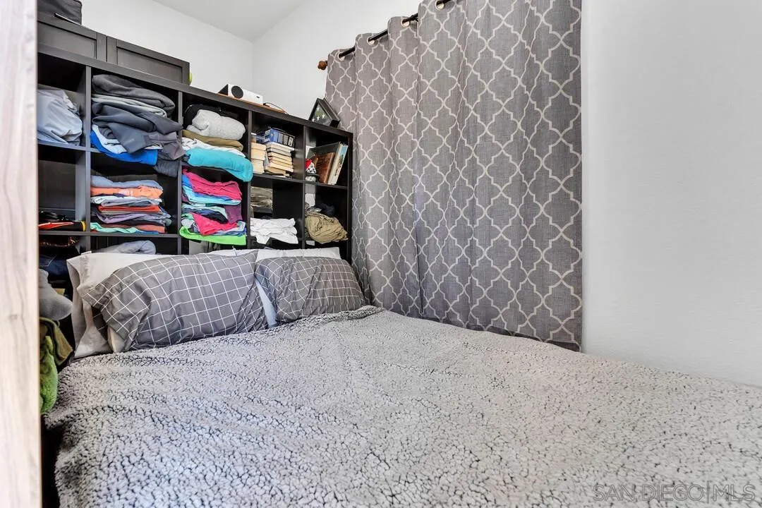 1347 Rex Lane El Cajon, CA 92021 - Photo 46 of 57 a bedroom with bed and walk in closet
