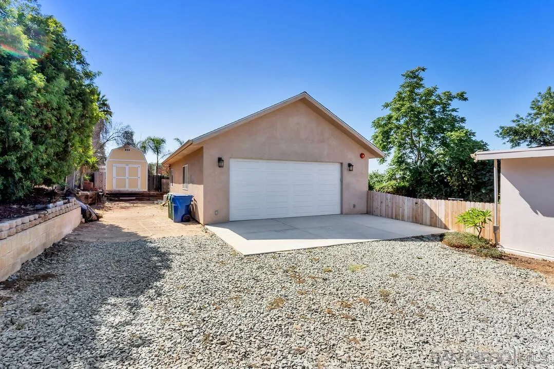 1347 Rex Lane El Cajon, CA 92021 - Photo 7 of 57 a front view of house with yard and trees in the background