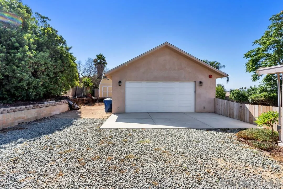 1347 Rex Lane El Cajon, CA 92021 - Photo 8 of 57 a front view of house with yard and trees
