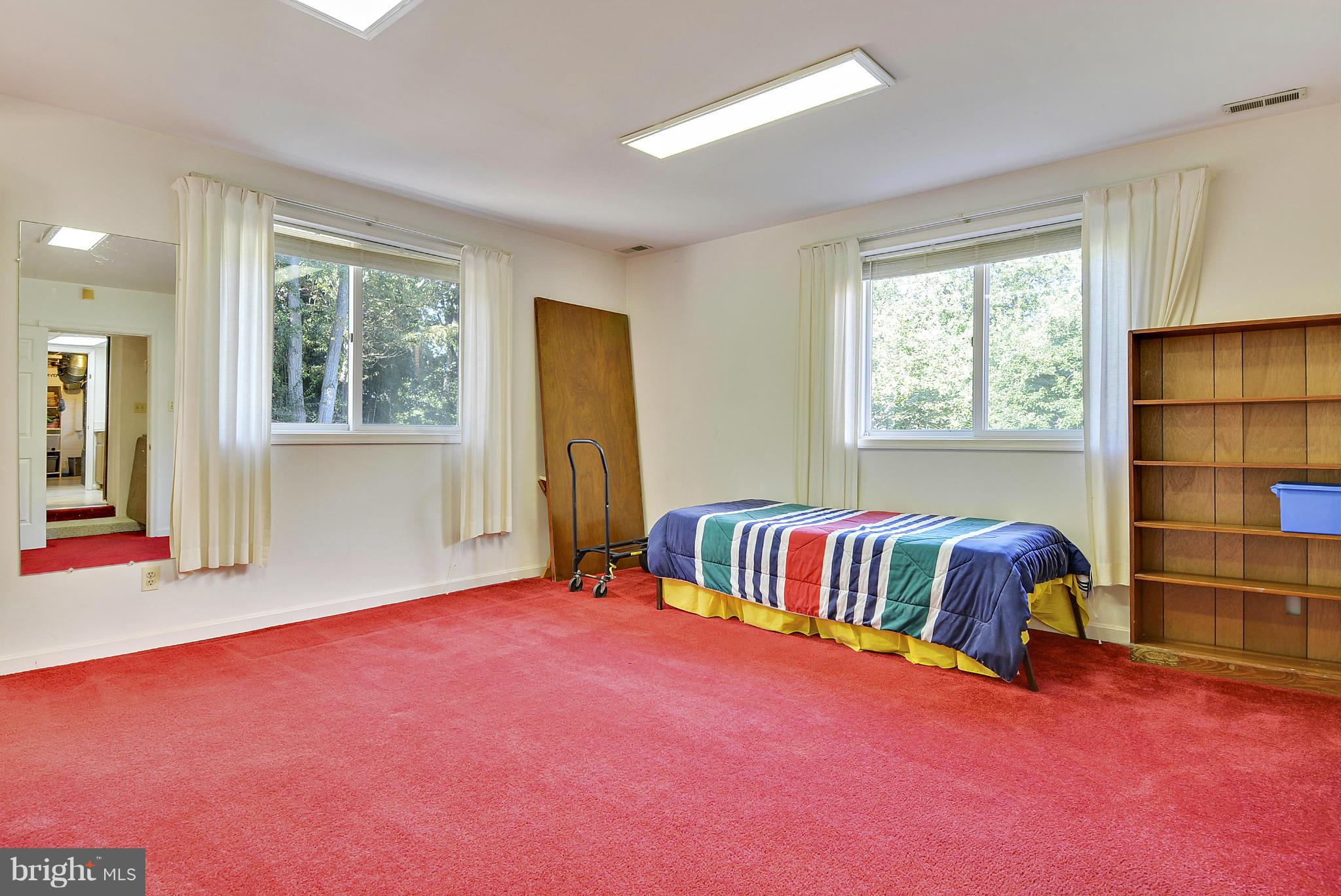 11113 Lombardy Road Silver Spring, MD 20901 - Photo 19 of 30 a spacious bedroom with a bed and window