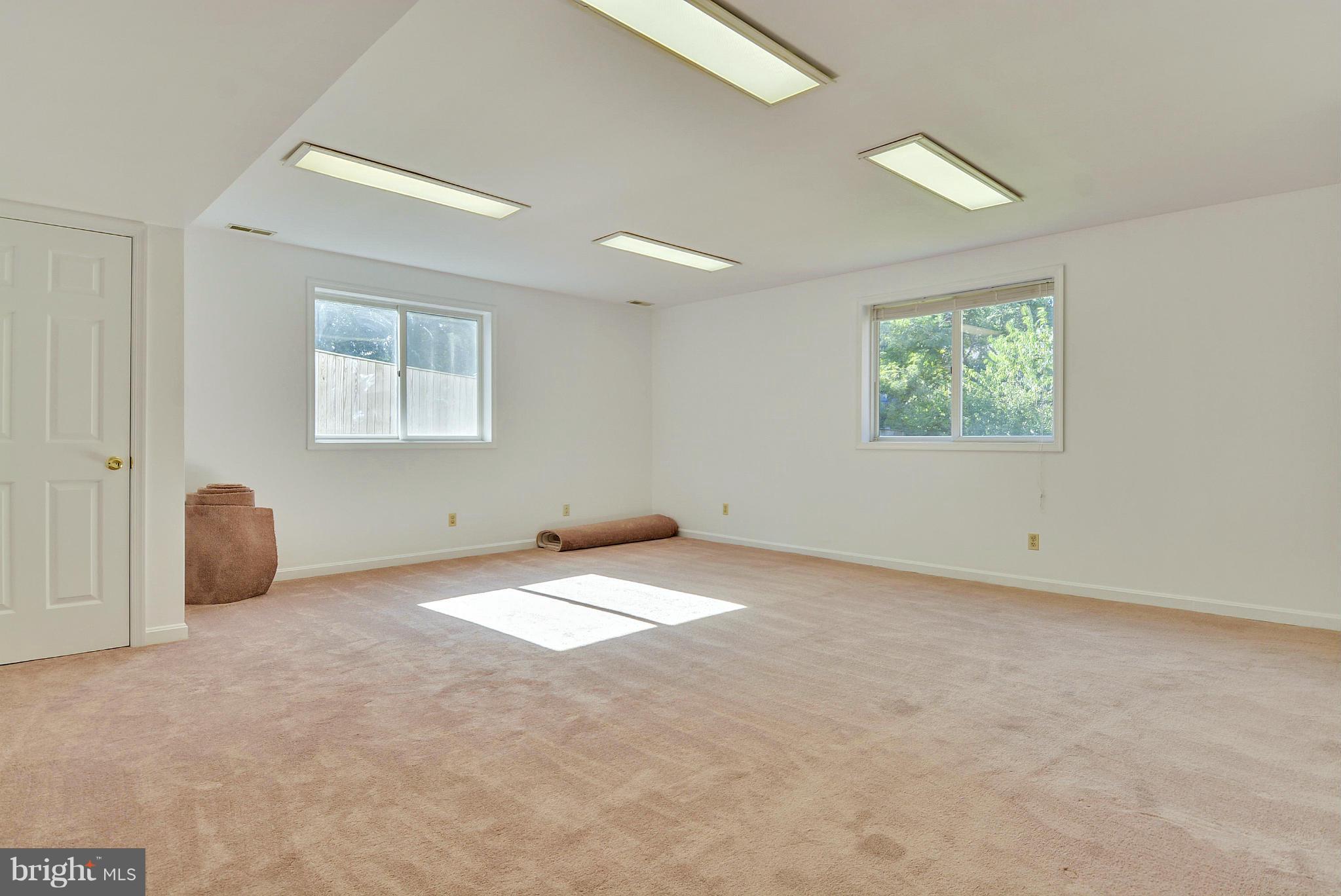 11113 Lombardy Road Silver Spring, MD 20901 - Photo 20 of 30 an empty room with windows and closet