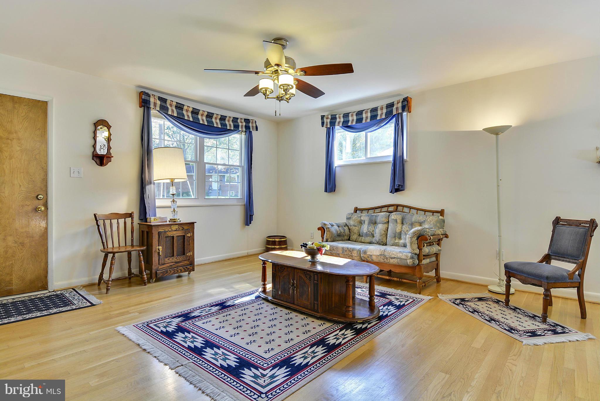 11113 Lombardy Road Silver Spring, MD 20901 - Photo 3 of 30 a living room with furniture and a rug