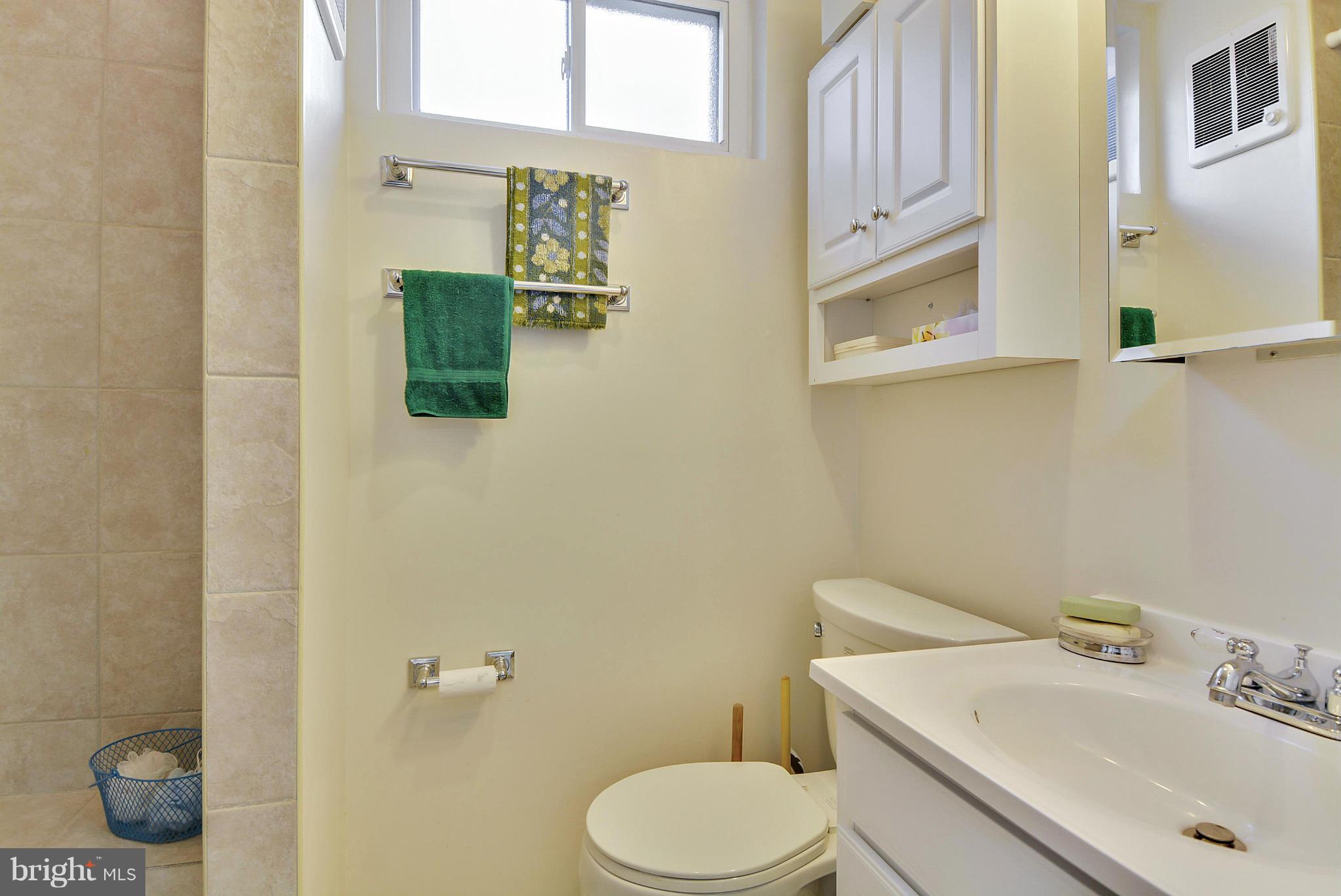 11113 Lombardy Road Silver Spring, MD 20901 - Photo 22 of 30 a bathroom with a sink mirror and toilet