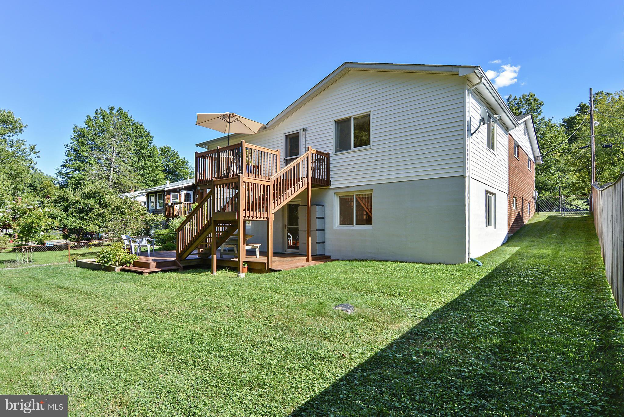 11113 Lombardy Road Silver Spring, MD 20901 - Photo 30 of 30 a view of a house with a yard and sitting area