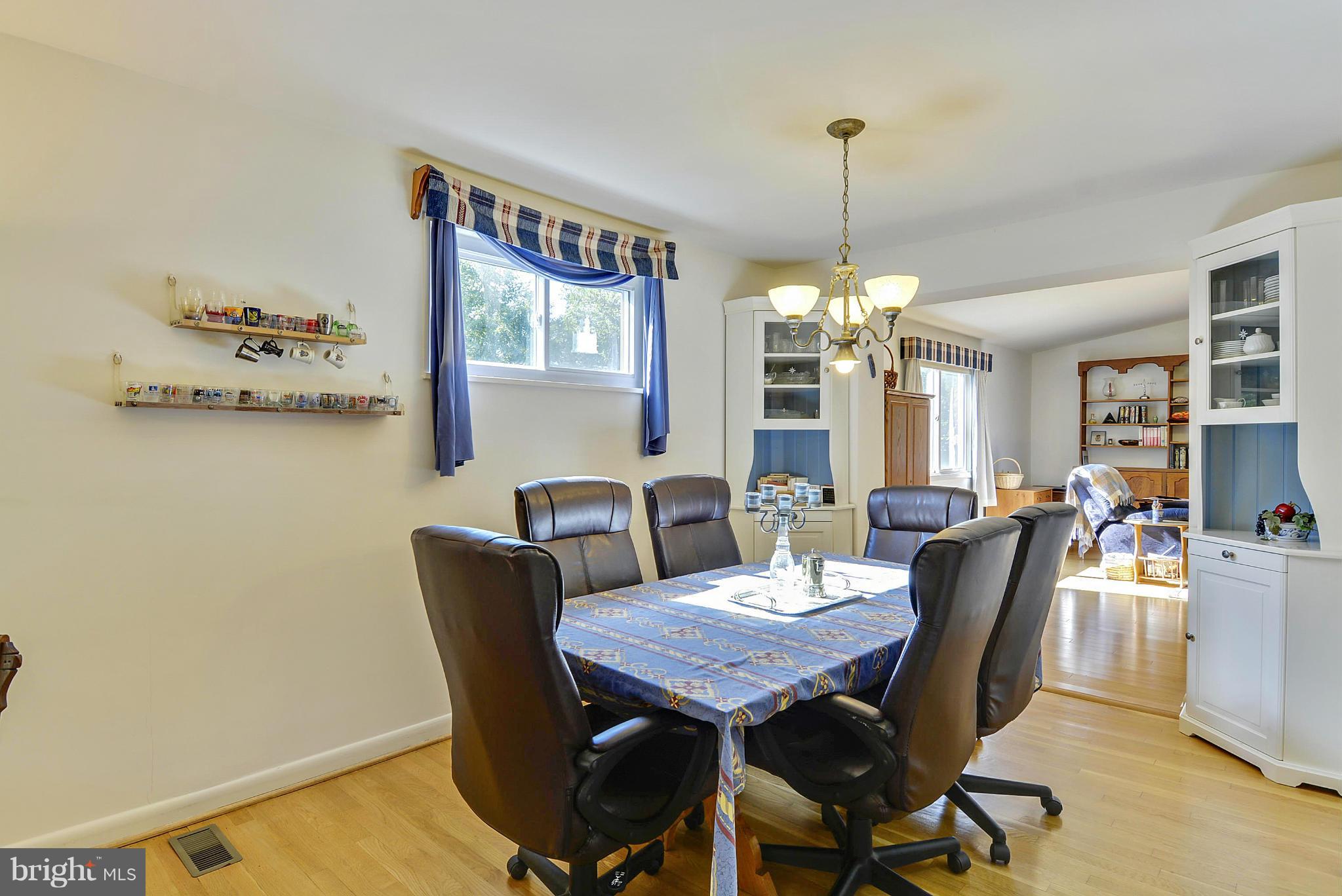 11113 Lombardy Road Silver Spring, MD 20901 - Photo 5 of 30 a view of a dining room with furniture window and wooden floor