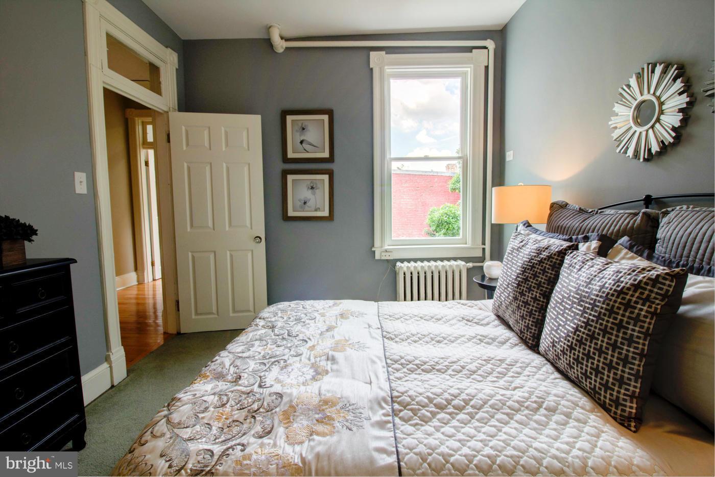 509 6th Street Northeast Washington, DC 20002 - Photo 21 of 30 a bedroom with a bed and a window