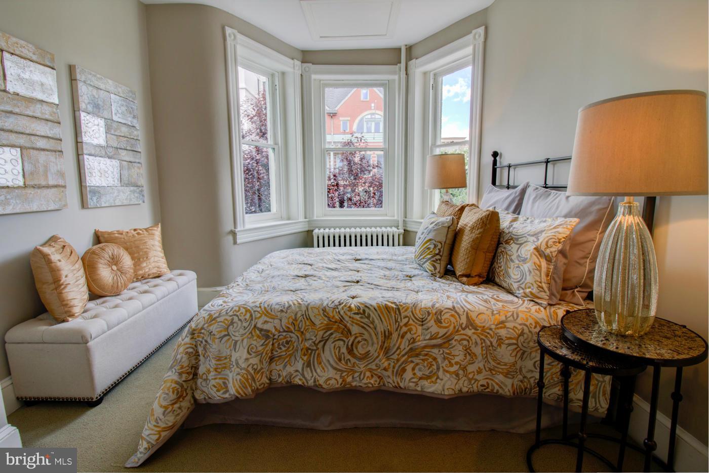 509 6th Street Northeast Washington, DC 20002 - Photo 24 of 30 a bedroom with a bed and wooden floor