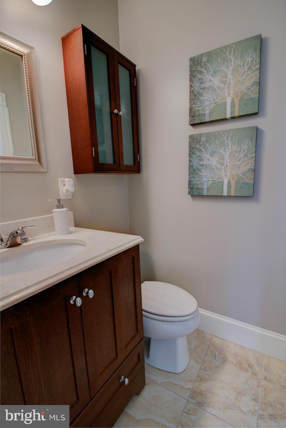 509 6th Street Northeast Washington, DC 20002 - Photo 28 of 30 a bathroom with a sink and a mirror