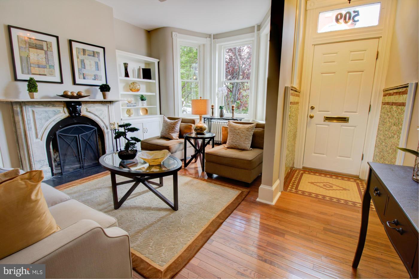 509 6th Street Northeast Washington, DC 20002 - Photo 4 of 30 a living room with furniture and a fireplace