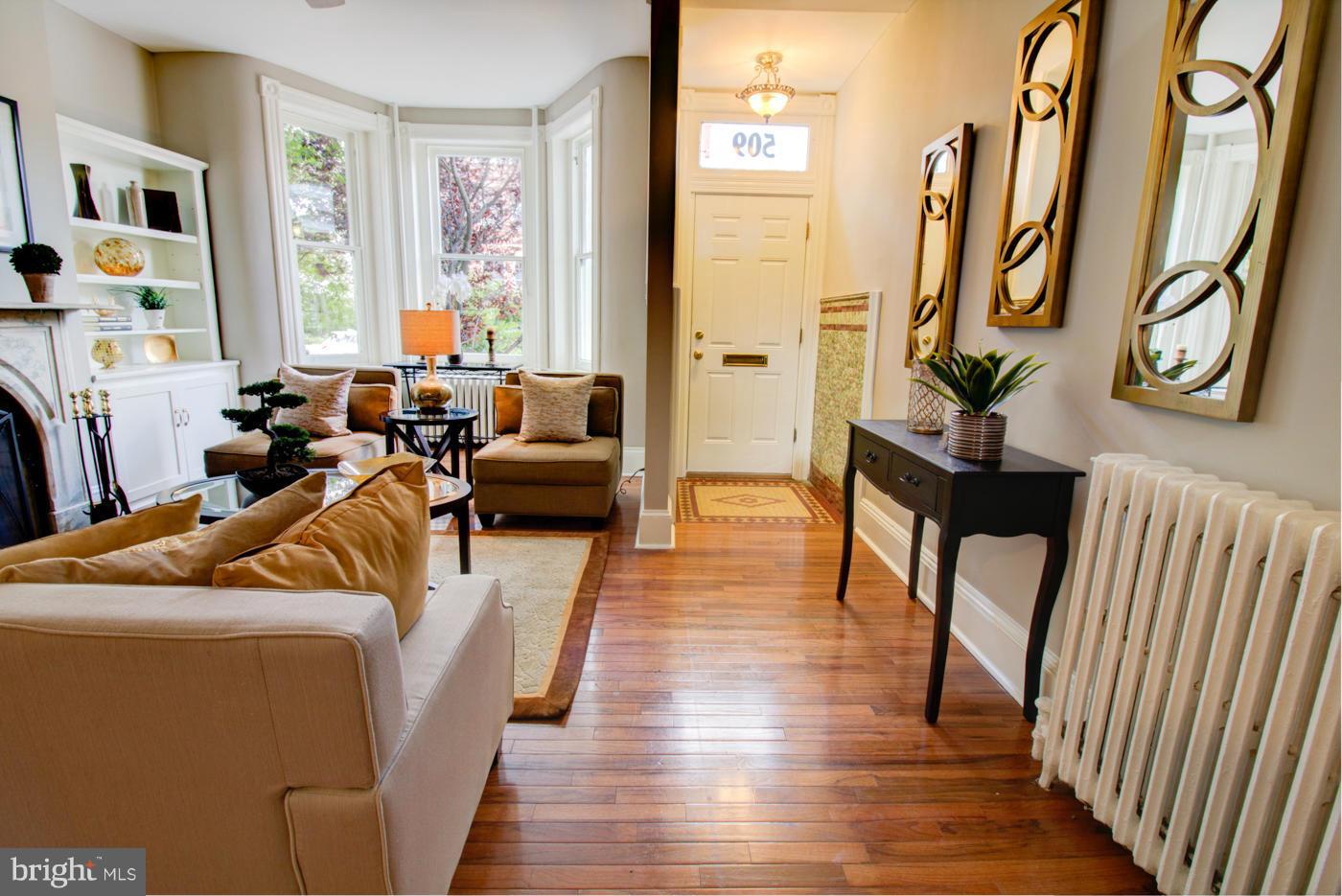 509 6th Street Northeast Washington, DC 20002 - Photo 5 of 30 a living room with furniture a fireplace and a large window