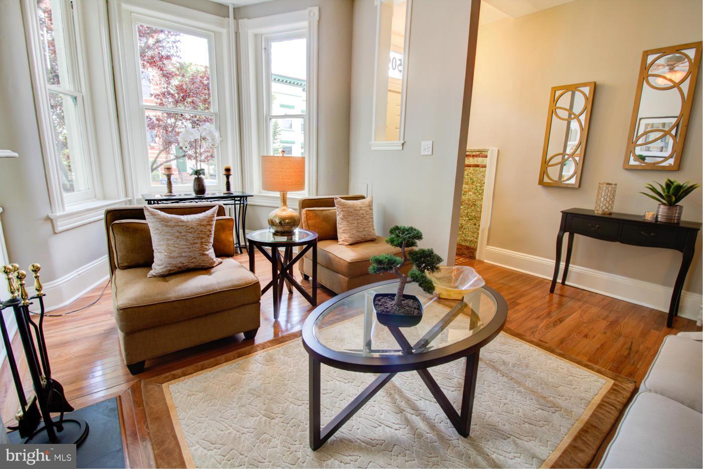509 6th Street Northeast Washington, DC 20002 - Photo 6 of 30 a living room with furniture and a window