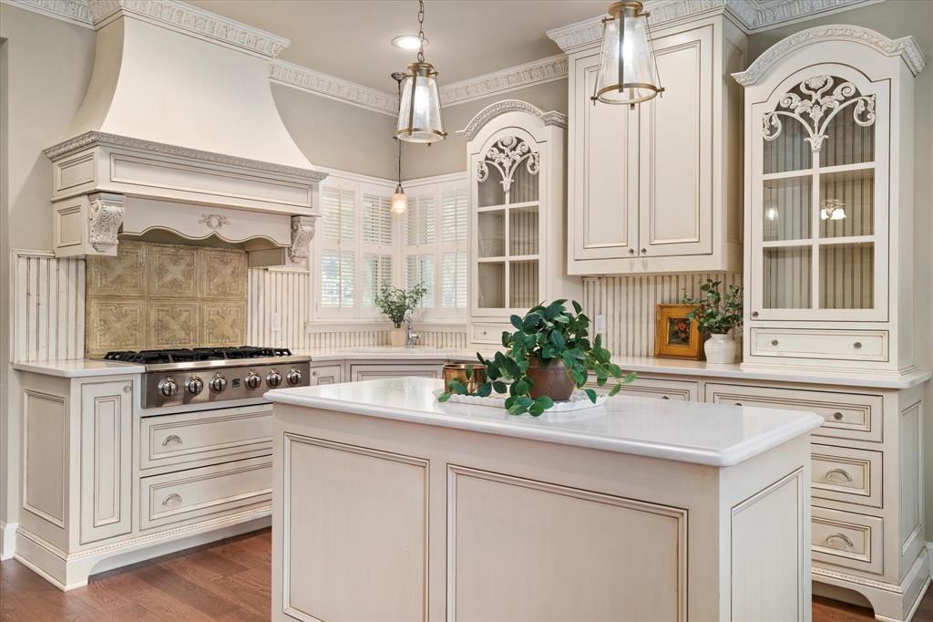 326 West Liberty Street Pilot Point, TX 76258 - Photo 15 of 40 a kitchen with granite countertop a stove a sink and a refrigerator
