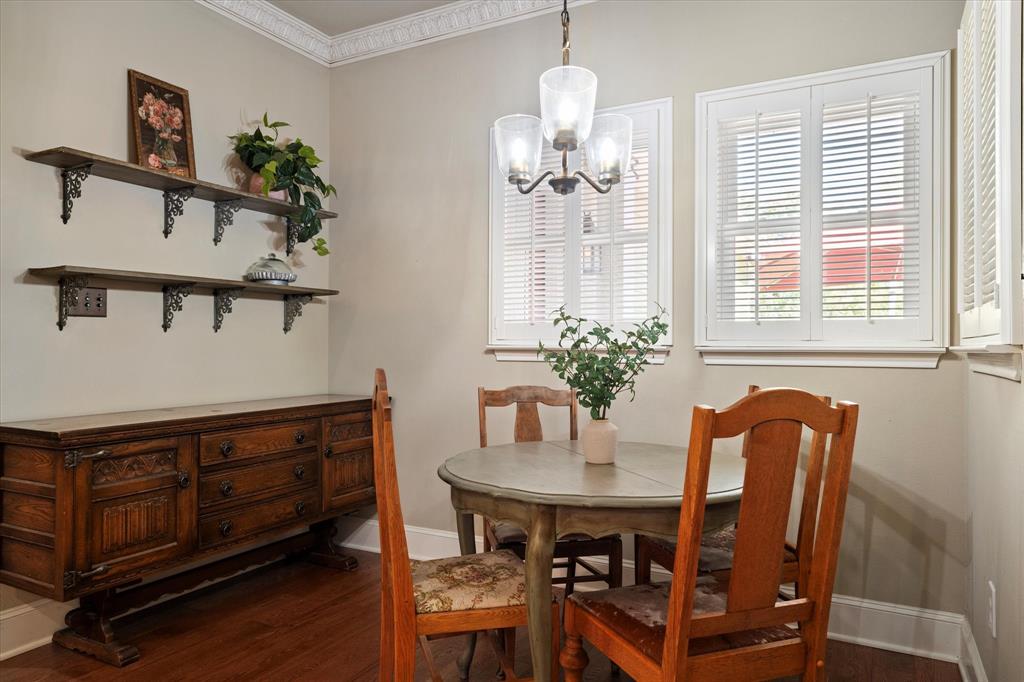 326 West Liberty Street Pilot Point, TX 76258 - Photo 17 of 40 a view of a dining room with furniture and chandelier