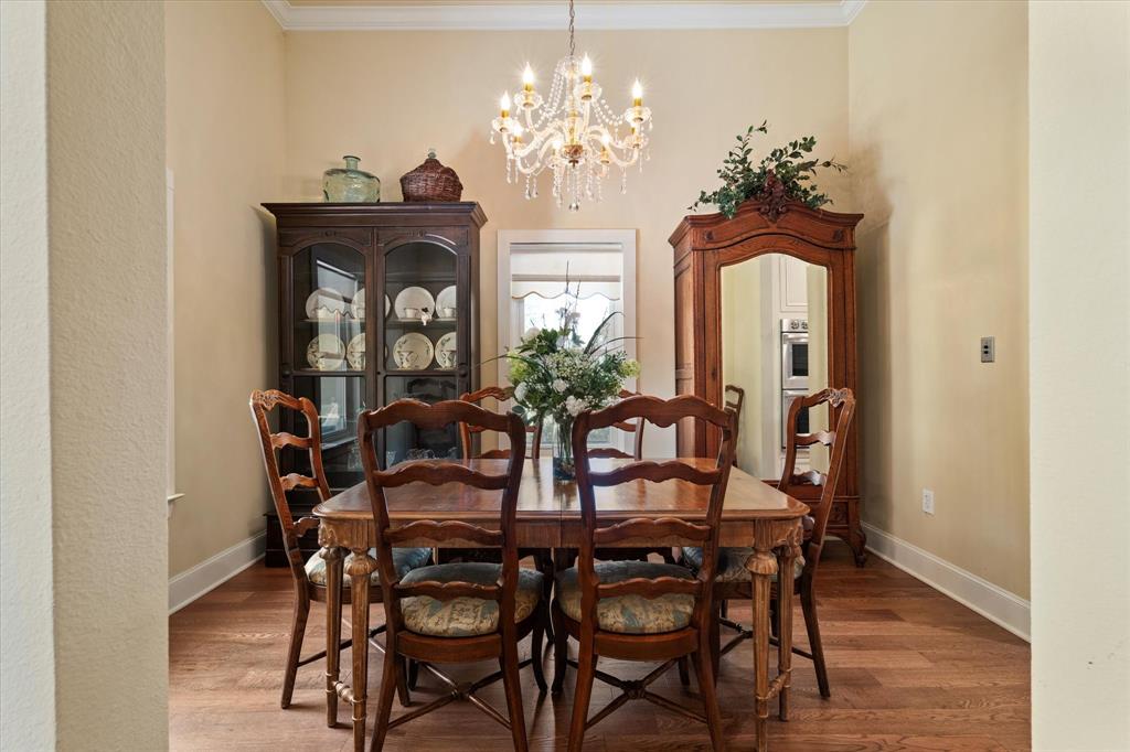 326 West Liberty Street Pilot Point, TX 76258 - Photo 18 of 40 a view of a dining room with furniture and chandelier