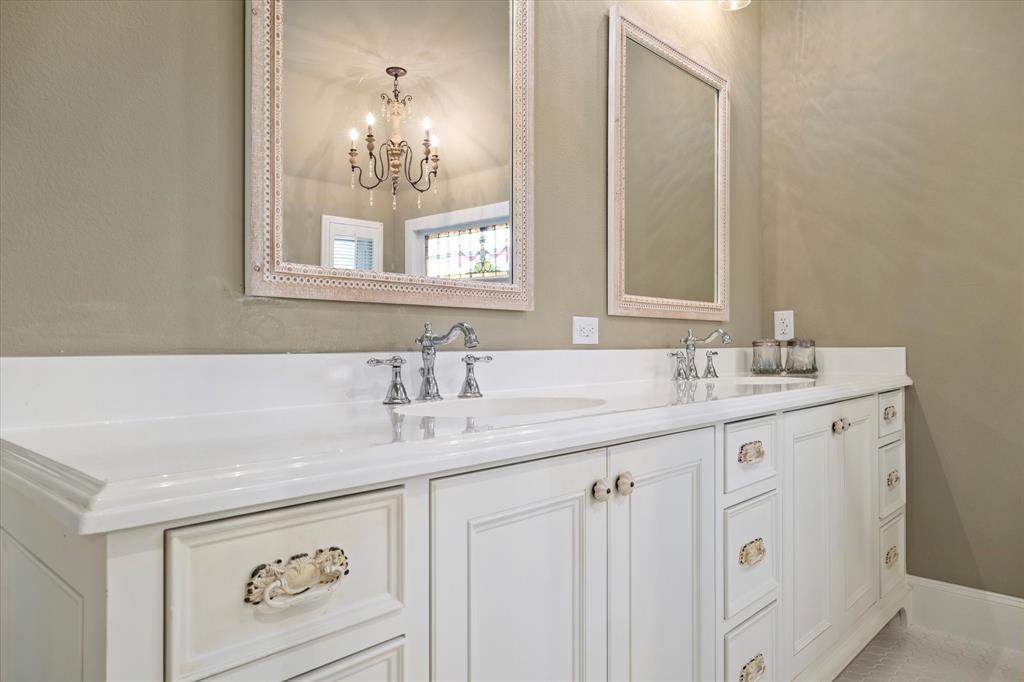 326 West Liberty Street Pilot Point, TX 76258 - Photo 22 of 40 a bathroom with a sink and a mirror