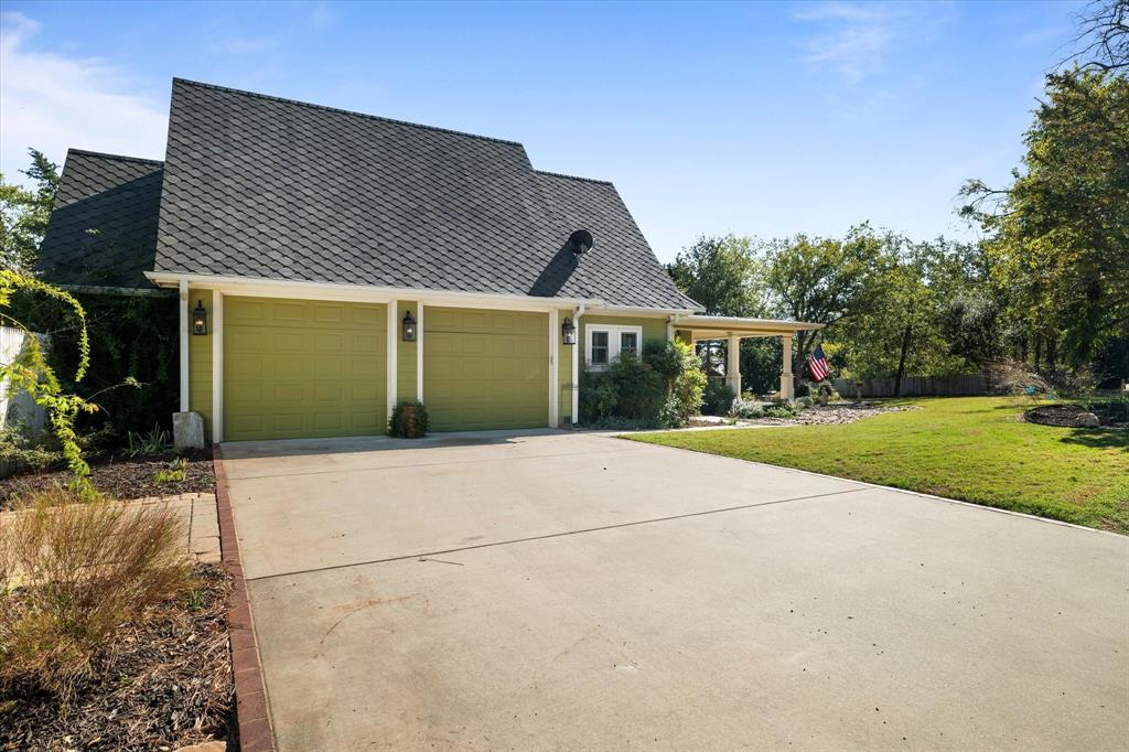 326 West Liberty Street Pilot Point, TX 76258 - Photo 38 of 40 front view of a house and a yard
