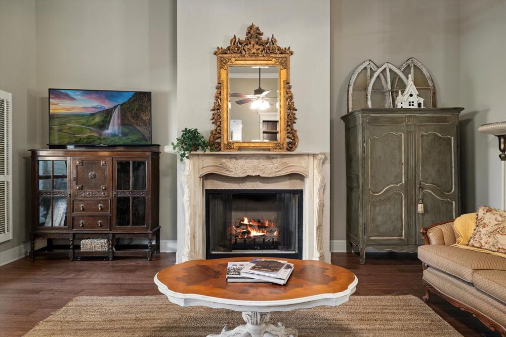326 West Liberty Street Pilot Point, TX 76258 - Photo 9 of 40 a living room with furniture and a fireplace
