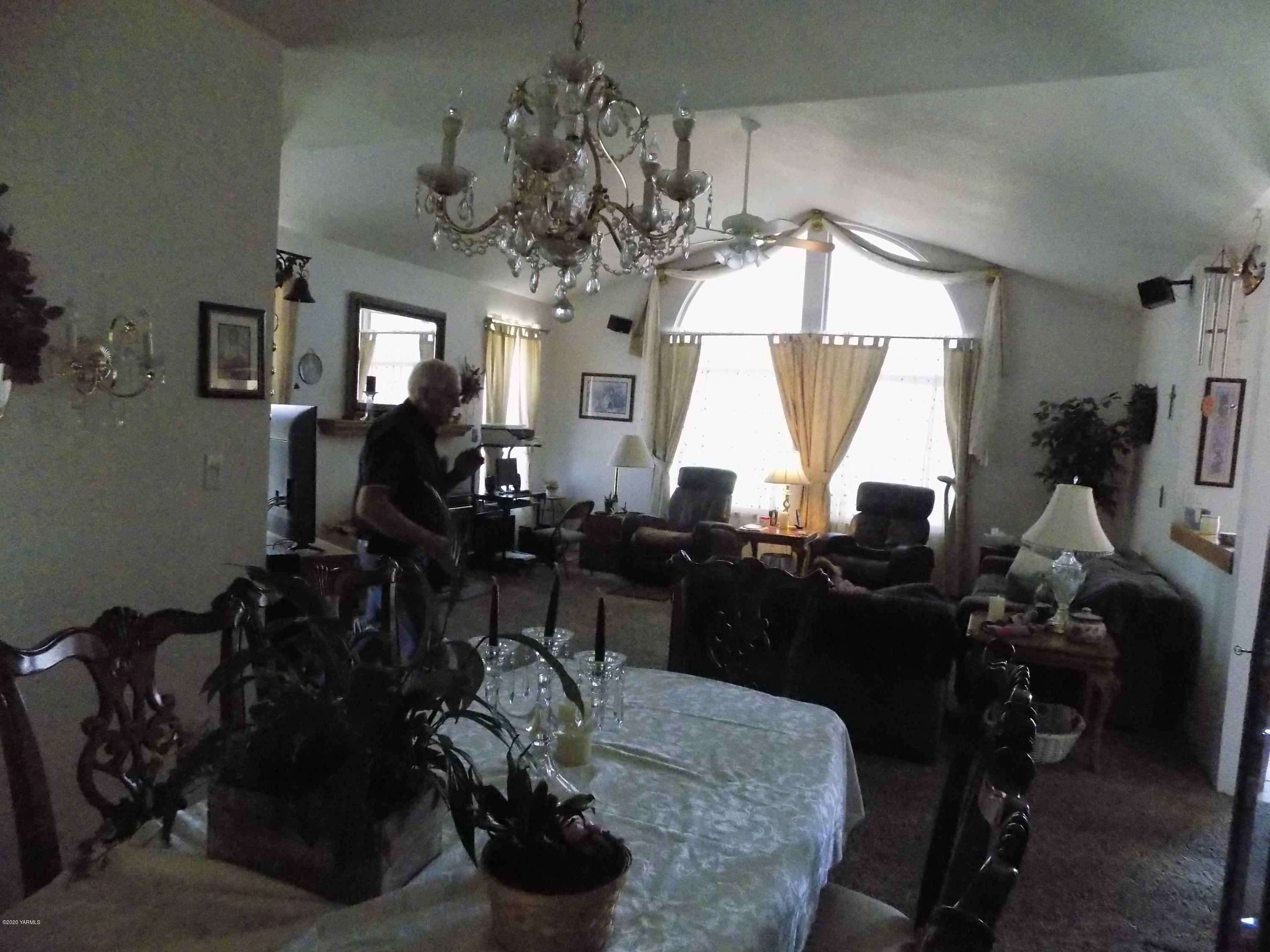 760 Sheep Co Road Selah, WA 98942 - Photo 3 of 37 a living room with dining table and chairs
