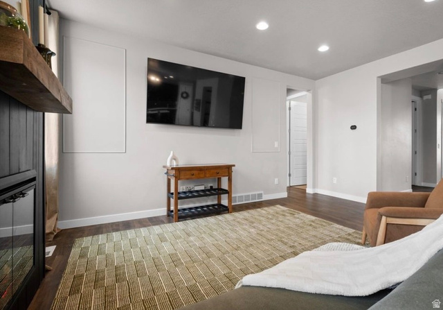 3359 Eurasian Crane Road Clinton, UT 84015 - Photo 14 of 71 Living area with dark wood-style flooring and recessed lighting
