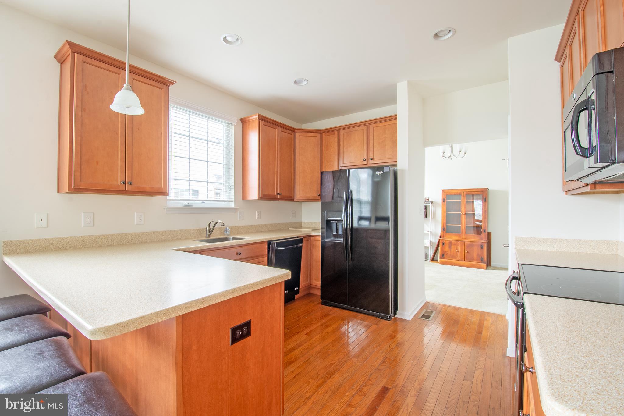 85 Bay Hill Road Magnolia, DE 19962 - Photo 15 of 31 a kitchen with stainless steel appliances granite countertop a refrigerator a sink dishwasher a stove with wooden floor and cabinets