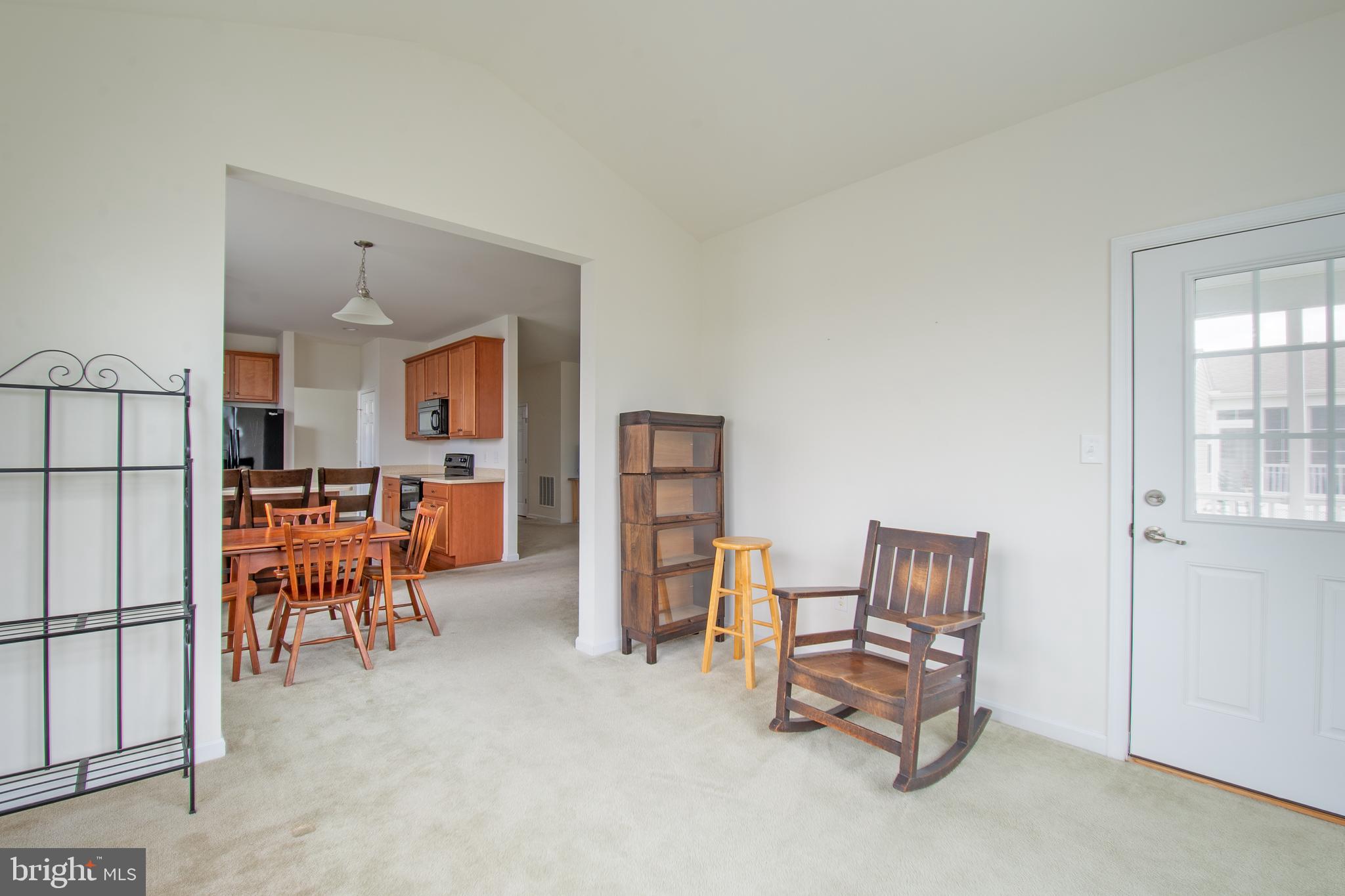 85 Bay Hill Road Magnolia, DE 19962 - Photo 19 of 31 a living room with furniture and a refrigerator