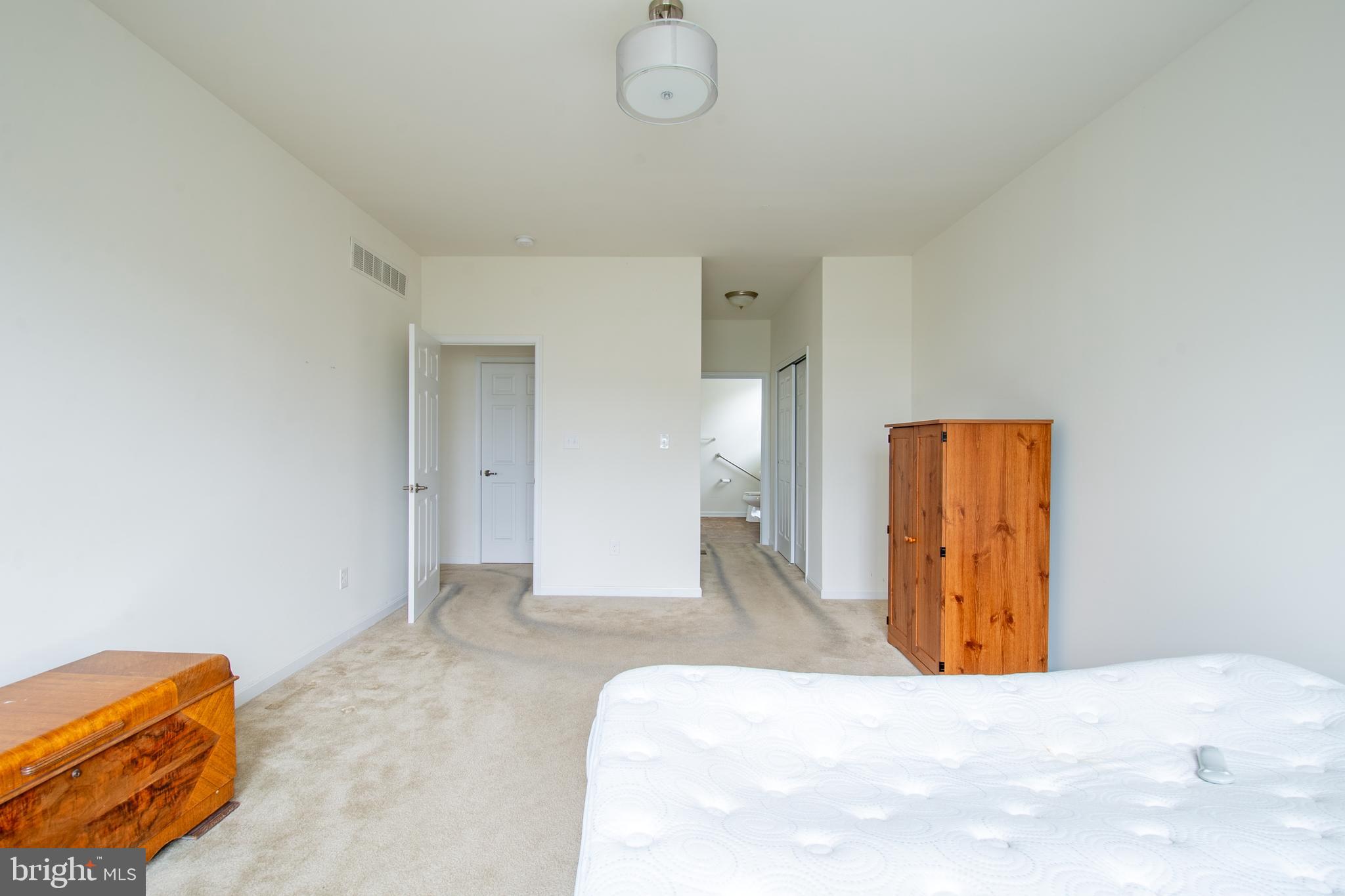 85 Bay Hill Road Magnolia, DE 19962 - Photo 22 of 31 a view of a bedroom with bed and mirror