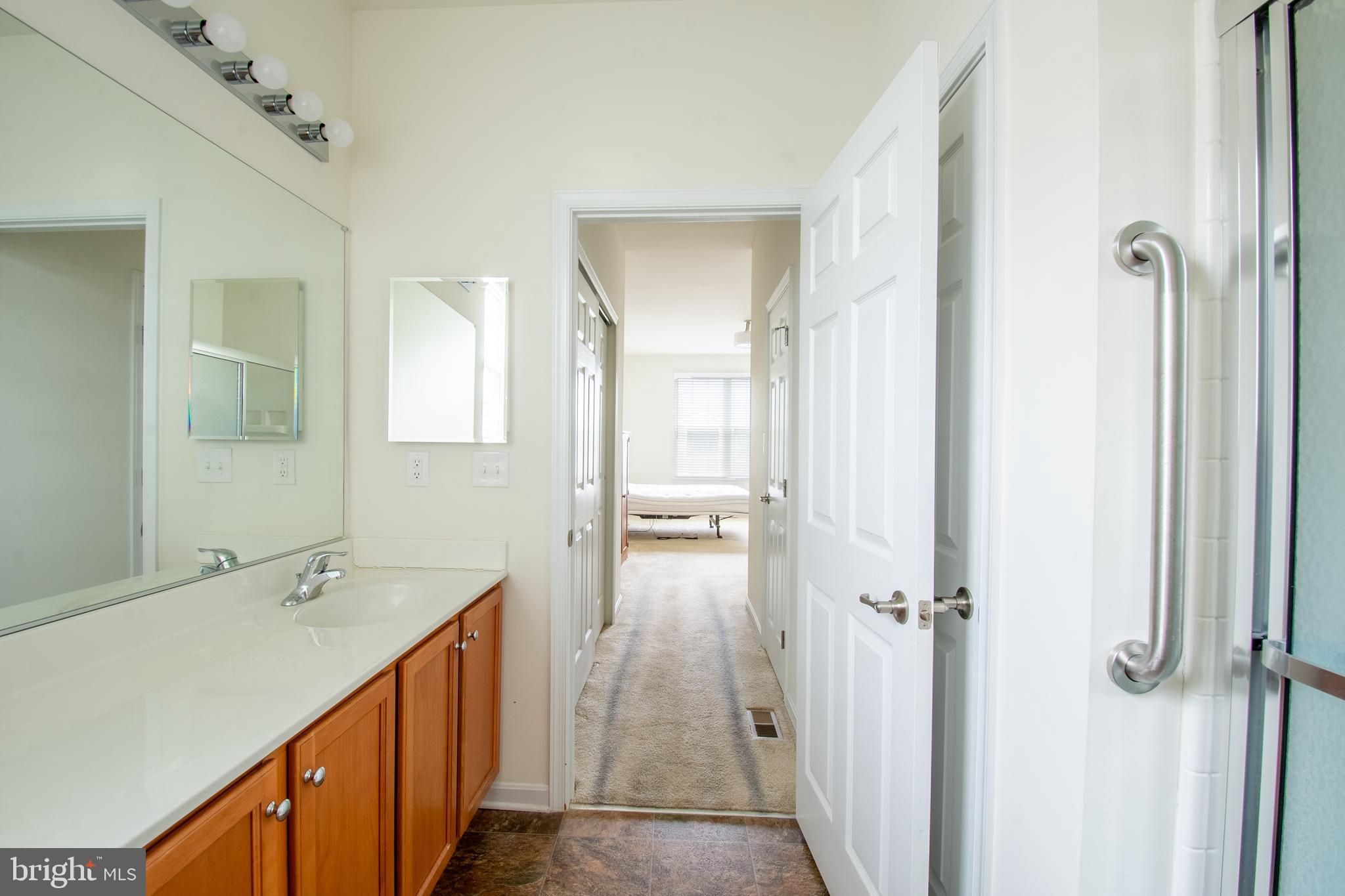 85 Bay Hill Road Magnolia, DE 19962 - Photo 24 of 31 a bathroom with a double vanity sink and mirror