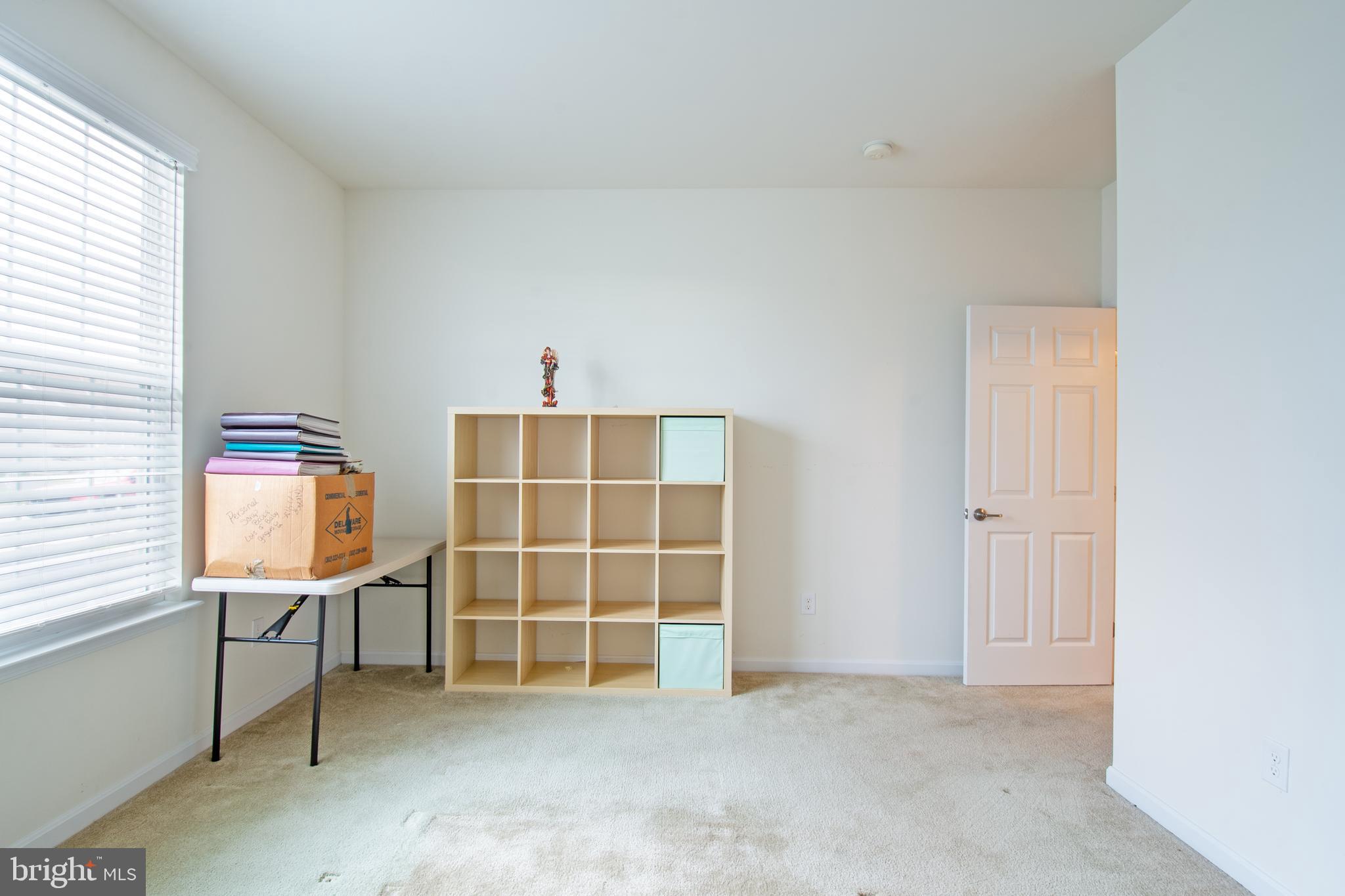 85 Bay Hill Road Magnolia, DE 19962 - Photo 26 of 31 an empty room with windows and cabinet
