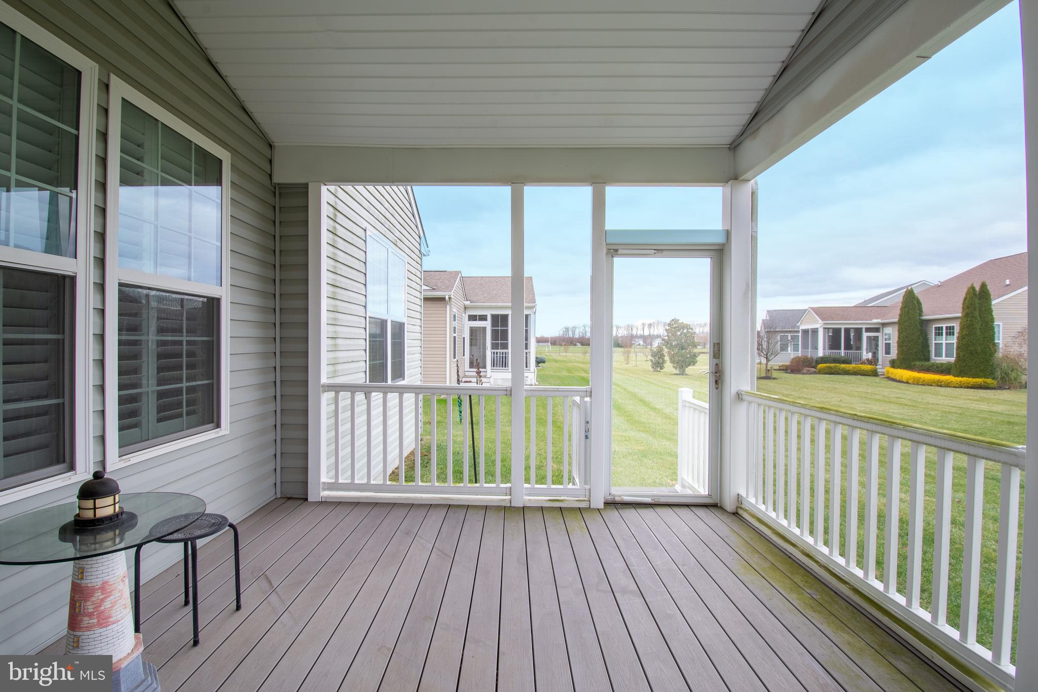 85 Bay Hill Road Magnolia, DE 19962 - Photo 30 of 31 a view of a porch with wooden floor and floor to ceiling window