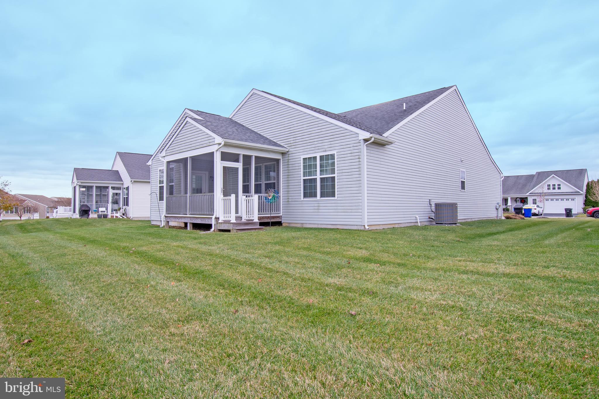 85 Bay Hill Road Magnolia, DE 19962 - Photo 4 of 31 a view of a house with a big yard potted plants and large tree