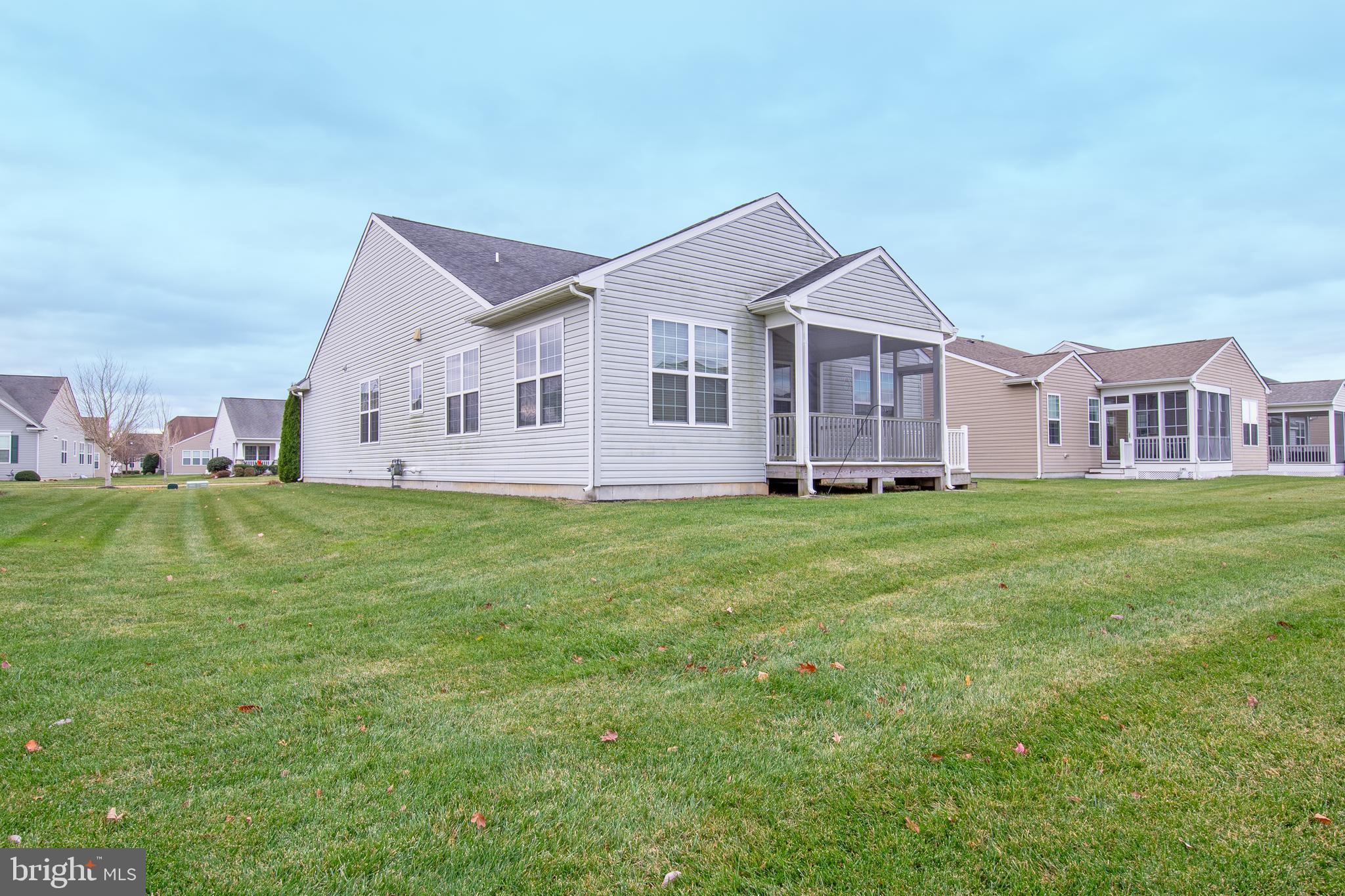 85 Bay Hill Road Magnolia, DE 19962 - Photo 5 of 31 a front view of a house with a garden and trees