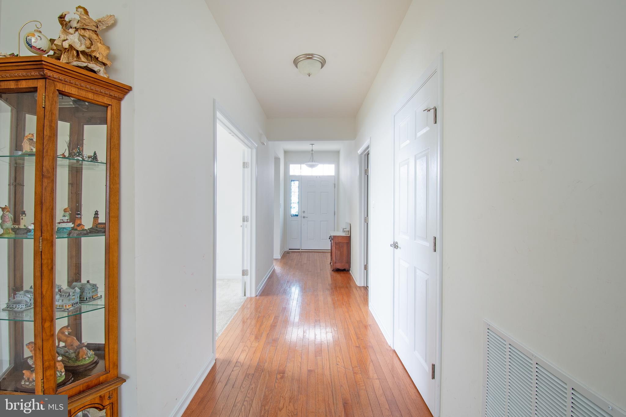 85 Bay Hill Road Magnolia, DE 19962 - Photo 6 of 31 a view of a hallway with wooden floor and closet