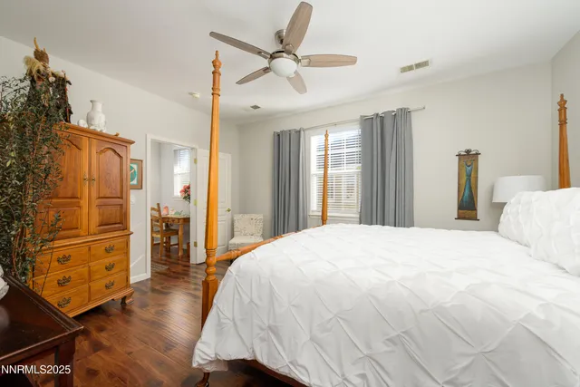 a spacious bedroom with a bed and a closet