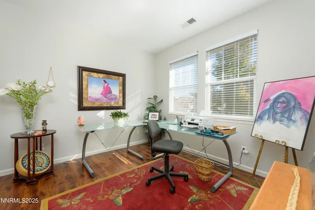 a workspace with furniture and wooden floor