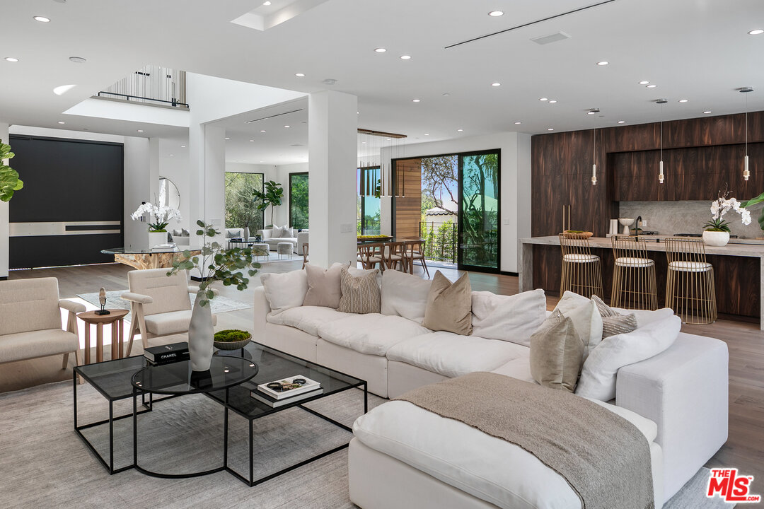 1461 Rising Glen Road Los Angeles, CA 90069 - Photo 12 of 22 a living room with furniture kitchen view and a large window