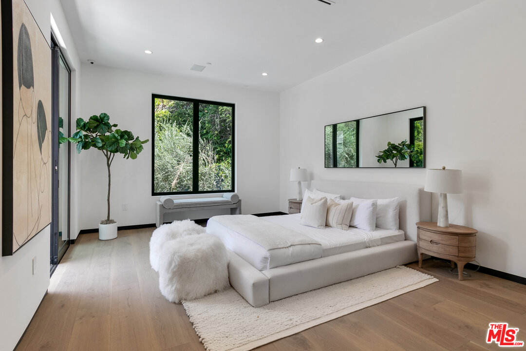 1461 Rising Glen Road Los Angeles, CA 90069 - Photo 20 of 22 a bed room with a bed and a window